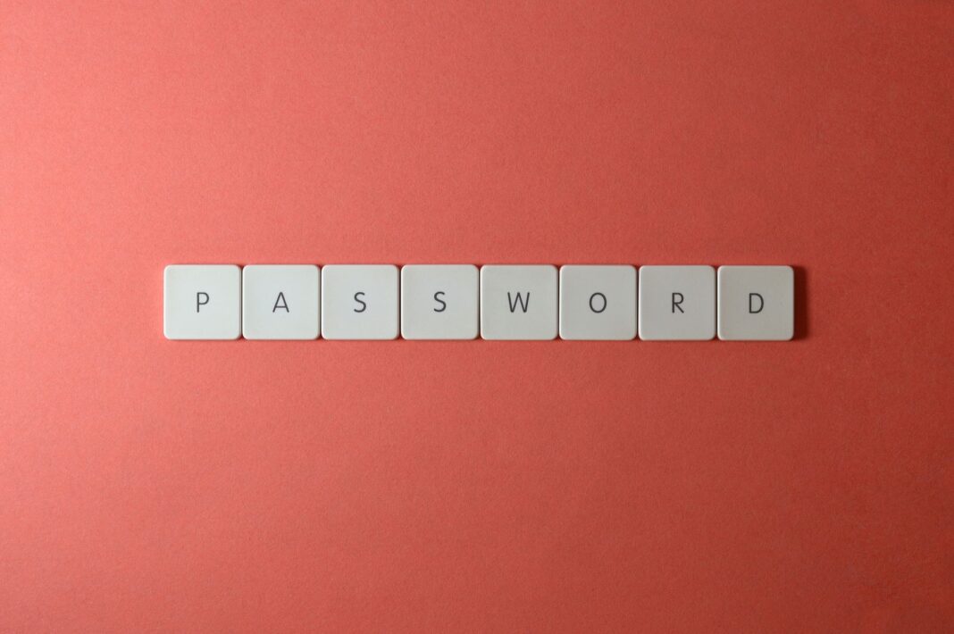 Białe klawisze układające napis PASSWORD na koralowym tle Białe klawisze układające napis PASSWORD na koralowym tle